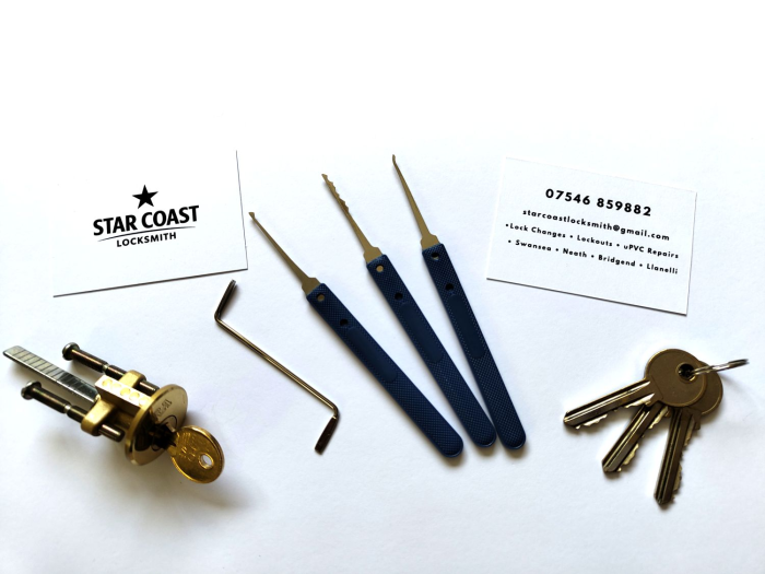 Professional locksmith tools and Star Coast Locksmith business card